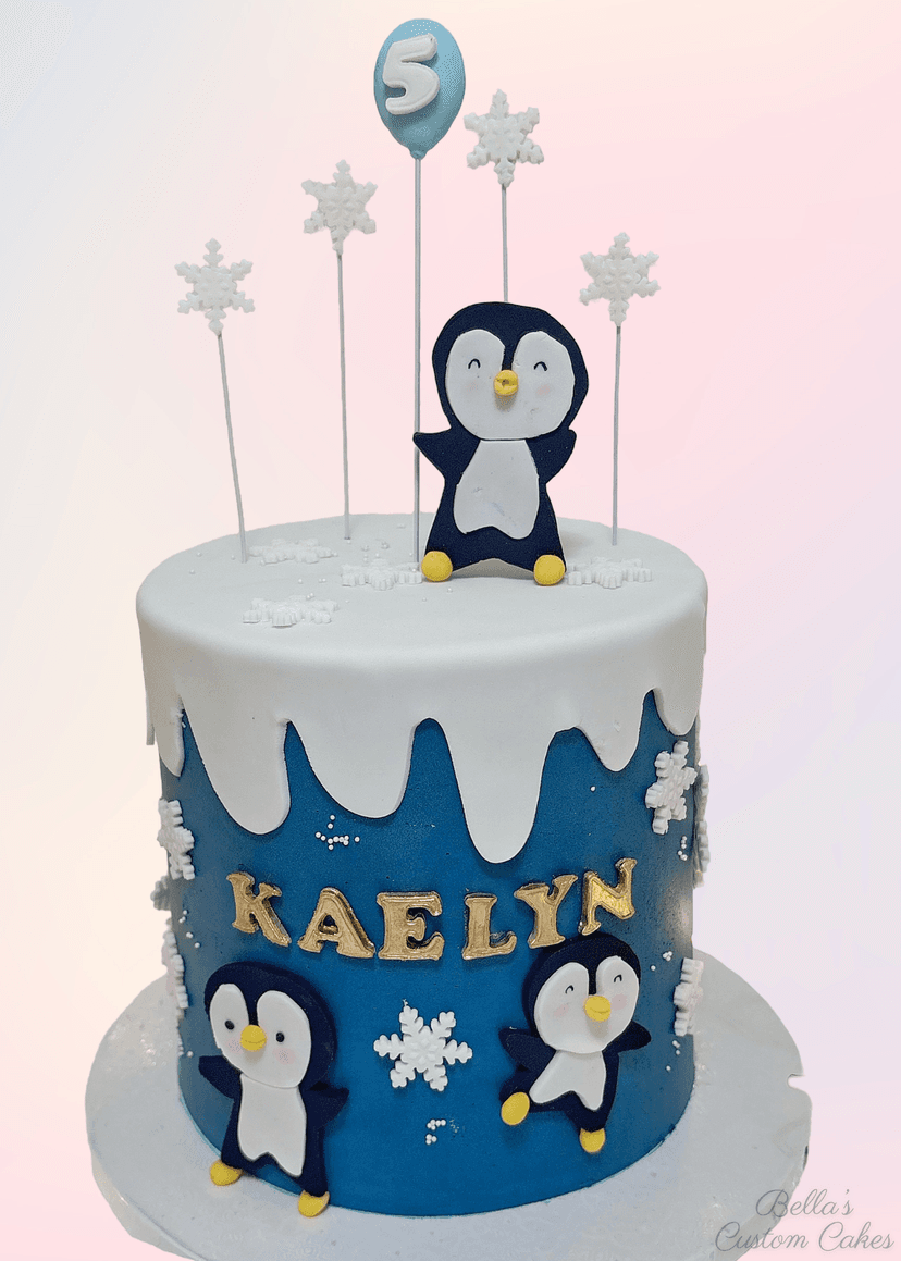 Classic round birthday cake with penguins