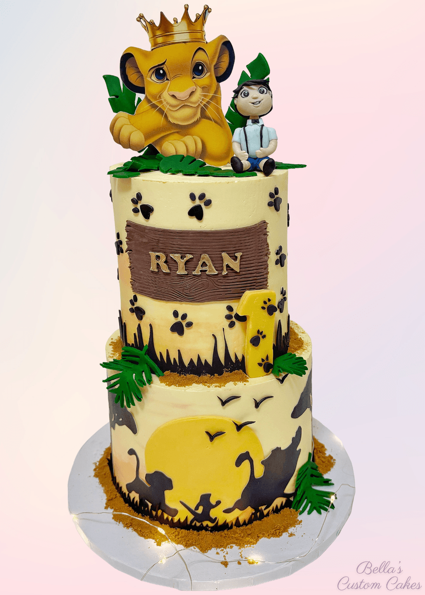 Two-tier birthday cake decorated with animals