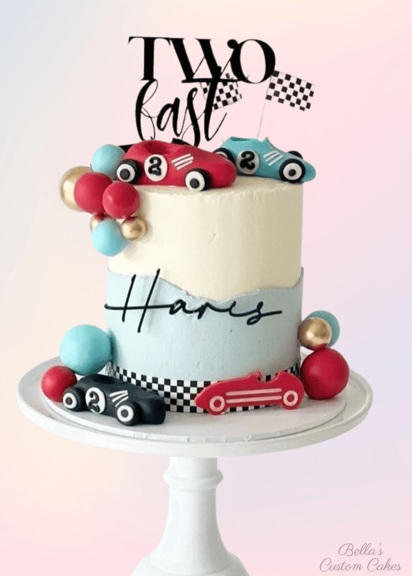 Race car themed cake with vibrant red and checkered flag design