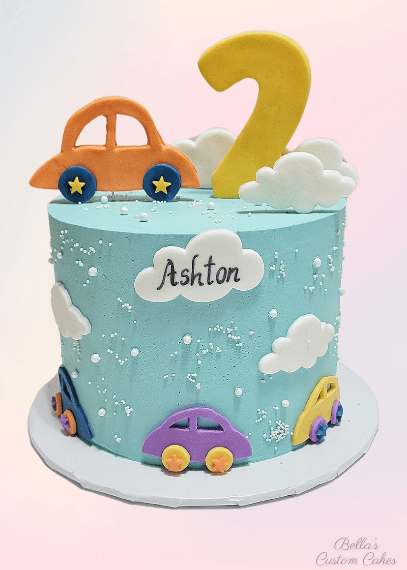 Cake decorated with cars and clouds