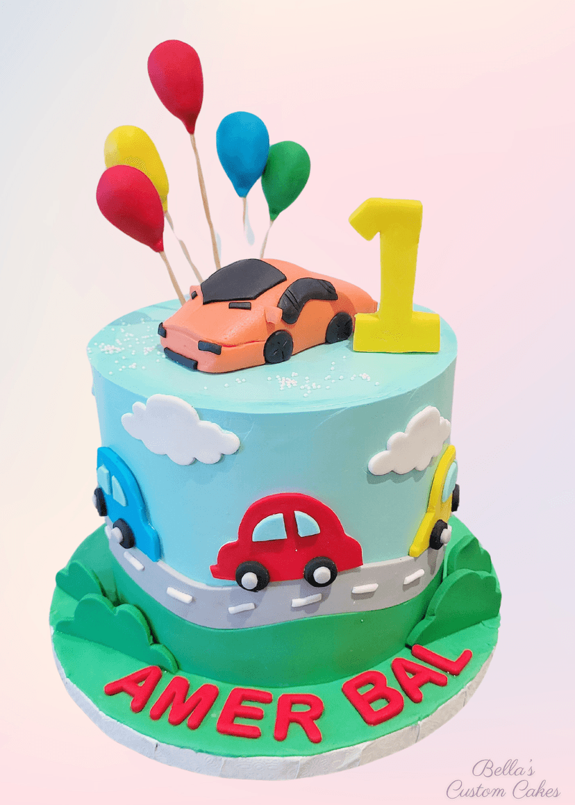 Colorful cake featuring car and balloons