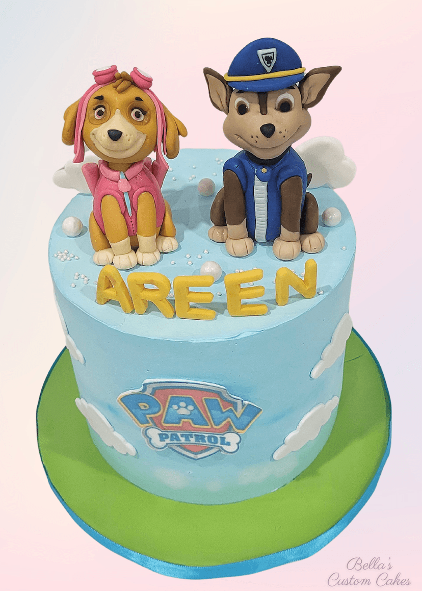 Bright Paw Patrol cake featuring Chase and Marshall figurines