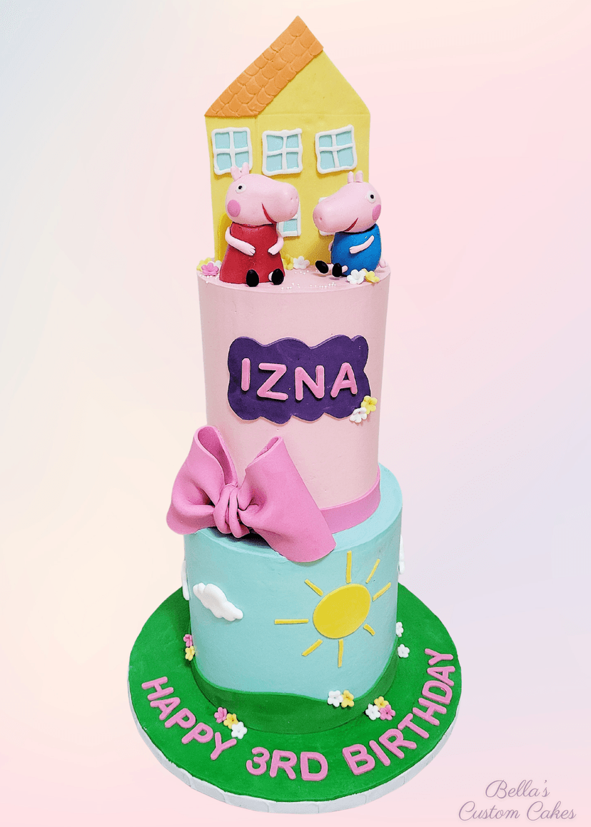 Two-tier Peppa Pig cake featuring bright pink frosting and character topper